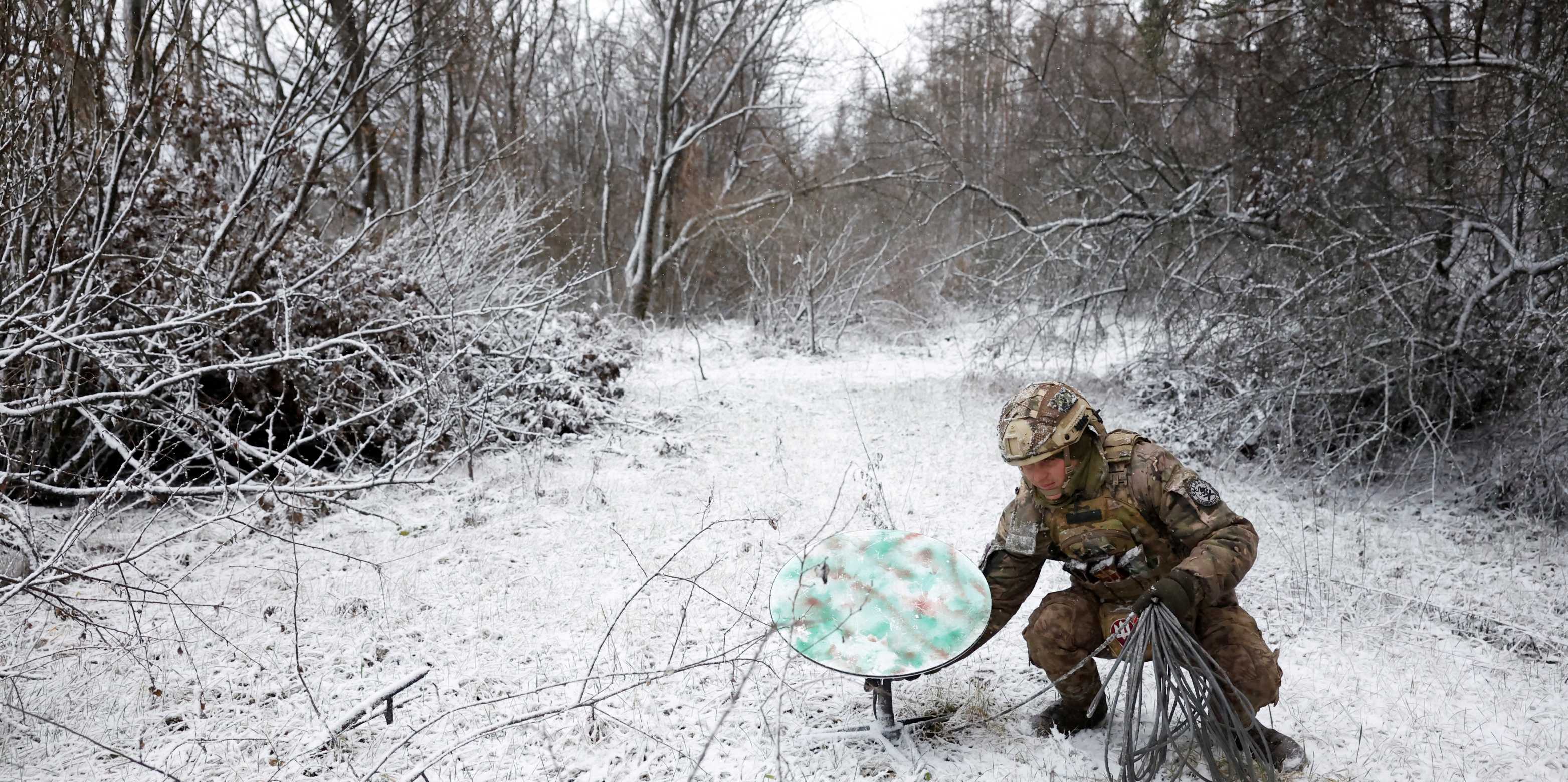 A Ukrainian soldier disconnects their Starlink during a ceasefire over the Orthodox Christmas period in  Kreminna, Ukraine in January 2023. Clodagh Kilcoyne / Reuters